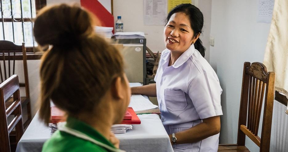A nurse provides counselling on sexually transmitted infections (STIs) t